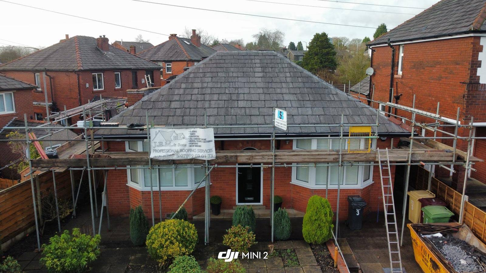 Slate roof installed by J.E.M Roofing on a brick bungalow